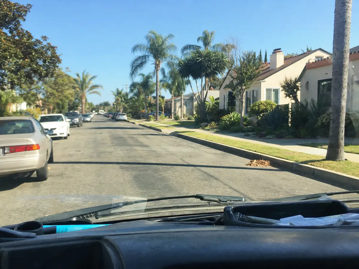 Service van arriving on a Covina, CA street — local same-day coverage